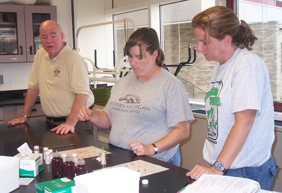 Three teachers in lab